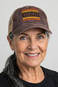 Woman wearing the 0500DISCIPLINE Women’s Washed Mesh-Back Cap — RETRO Edition in Chocolate / Fawn / Khaki